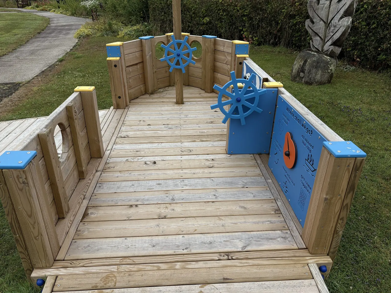 Interior deck of All Ability Tug Boat with interactive ship wheel and sensory play panel