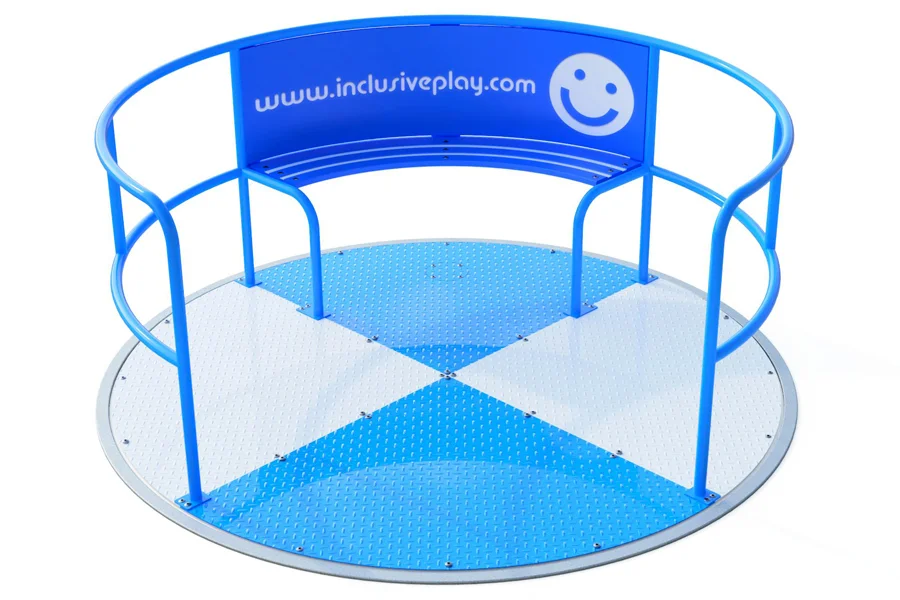 The Inclusive Wheelspin Roundabout in a standard blue and white design, with a smiley face logo, demonstrating its wheelchair-friendly, flush-to-surface platform.