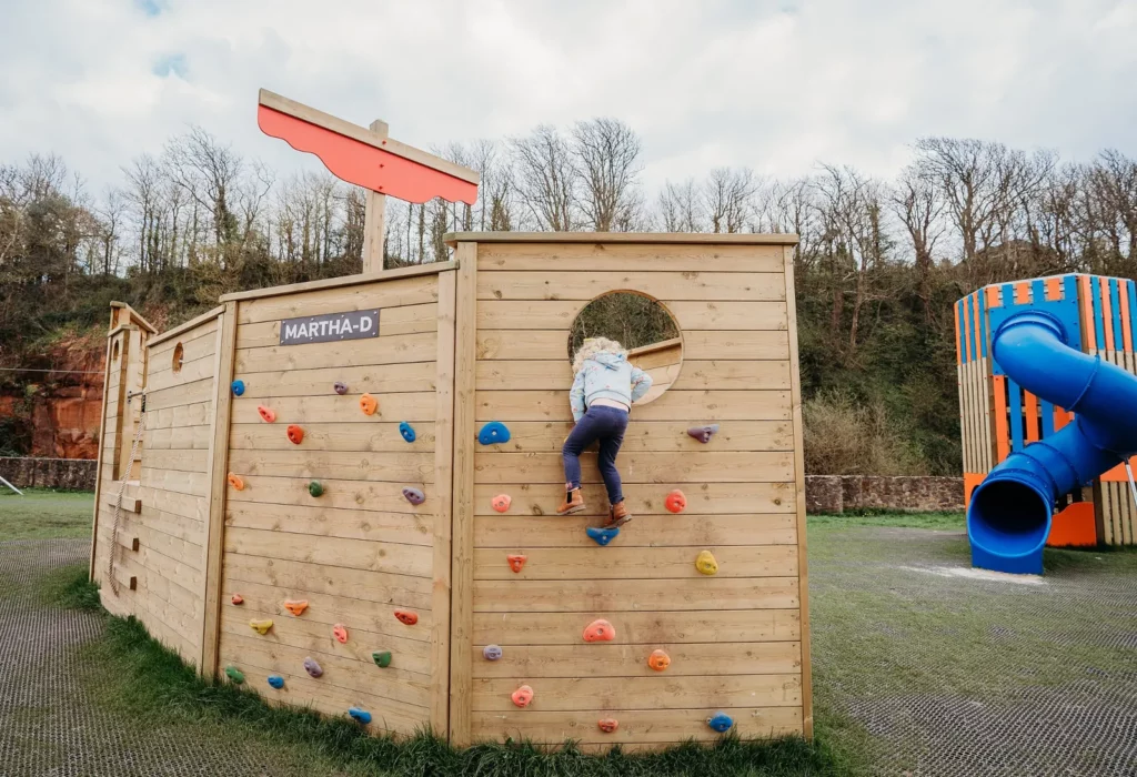 Close-up detail of Martha D timber play boat climbing structure made from durable wooden playground equipment