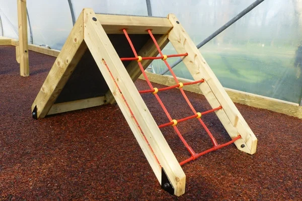 The net climber side of the wooden Mini Ramp Net Climber, showing the red rope net on a red rubber crumb surface.
