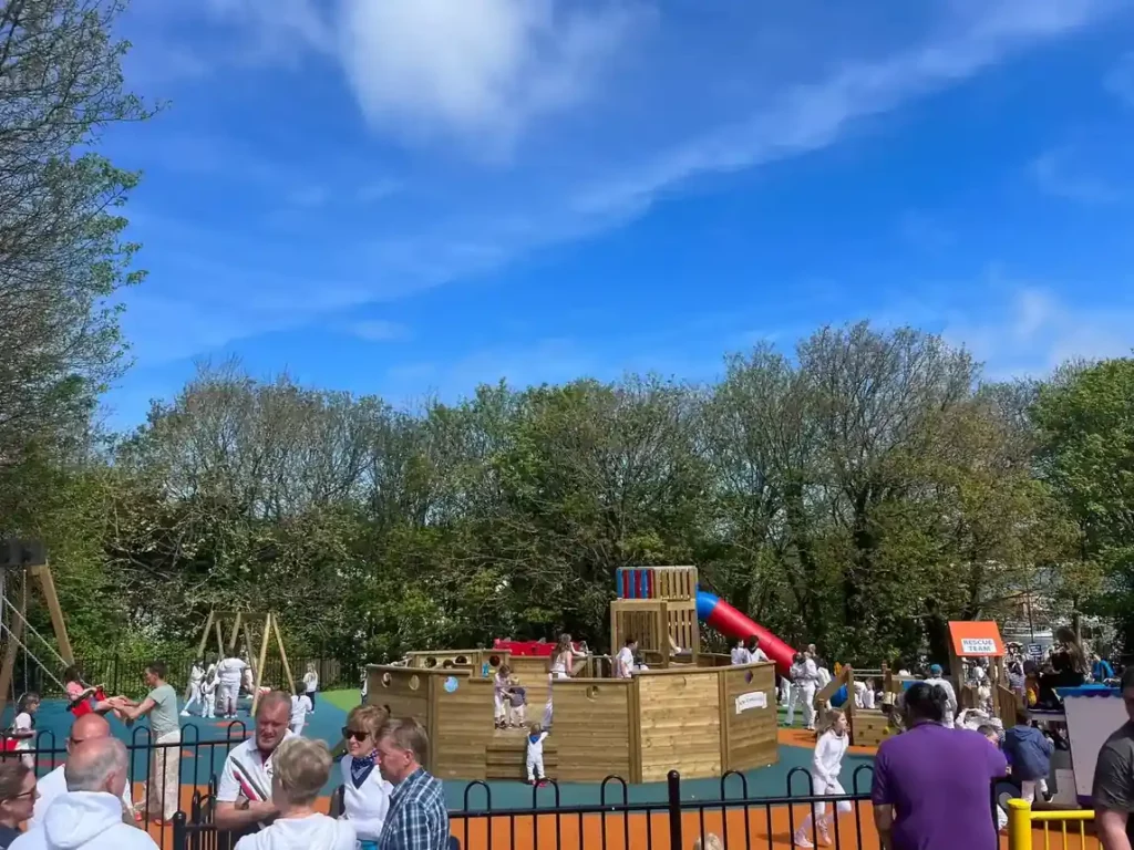 Detailed view of wooden Padstow trawler themed timber play equipment in a playground setting