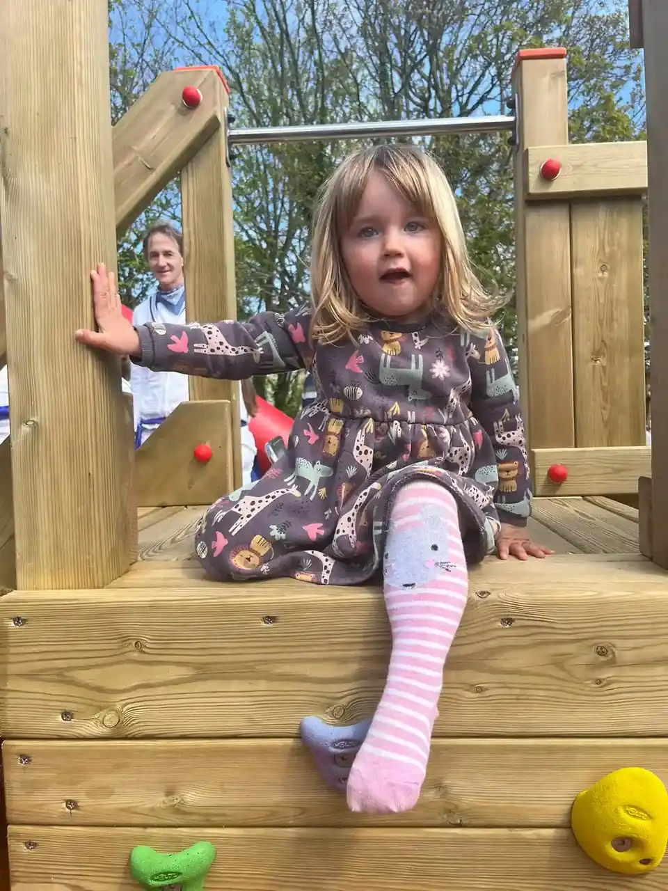 Child climbing on Padstow Trawler timber play boat in outdoor playground