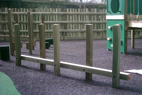 A wooden Post Weave outdoor play equipment on a black rubber crumb safety surface in a modern playground.