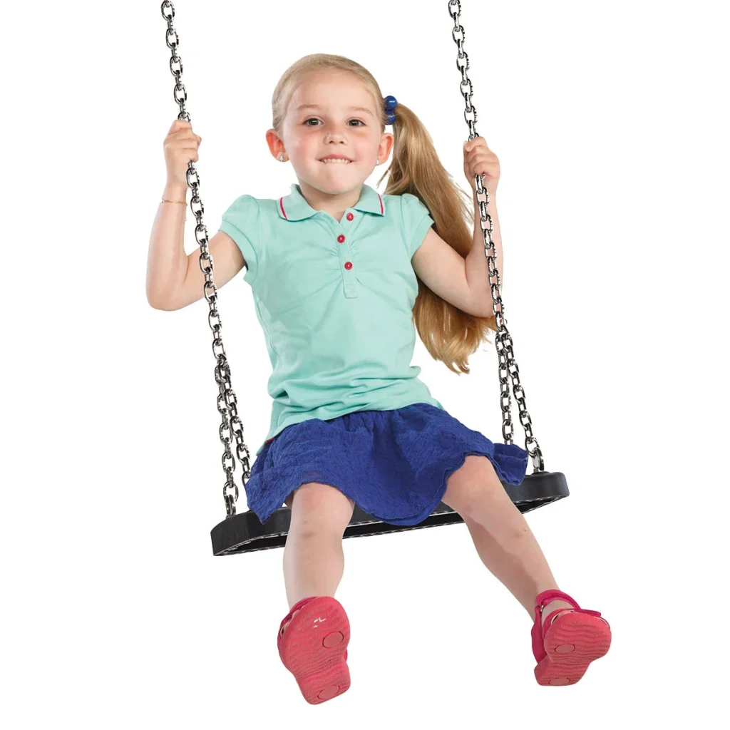 Child swinging on a curved flat wooden swing seat in a timber playground play equipment