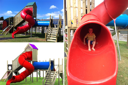 Timber outdoor playhouse with rustic design in a school playground setting
