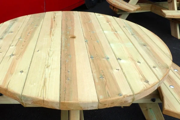 Round wooden picnic table outdoor seating