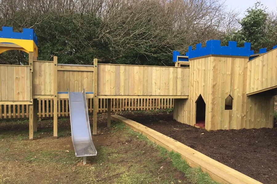 Wooden castle playground climbing frame